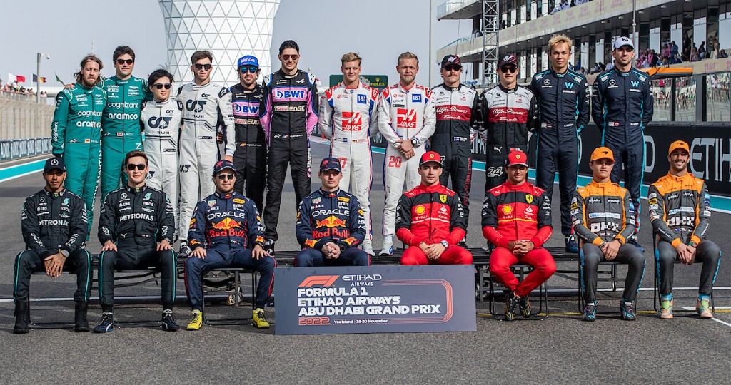Driver lineups for the 2022 Formula One racing season - standing back row: Sebastian Vettel and Lance Stroll of Aston Martin, Yuki Tsunoda and Pierre Gasly of AlphaTauri, Fernando Alonso and Esteban Ocon of Alpine, Mick Schumacher and Kevin Magnussen of Haas, Valtteri Bottas and Zhou Guanyu of Alfa Romeo, and Alex Albon and Nicholas Latifi of Williams Racing; seated front row: Lewis Hamilton and George Russell of Mercedes, Sergio Pérez and Max Verstappen of Red Bull, Charles LeClerc and Carlos Sainz of F1 and Lando Norris and Daniel Ricciardo of McLaren