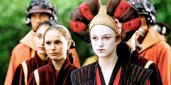 Natalie Portman as Queen Padme Amidala disguised as a handmaiden next to Keira Knightley as handmaiden Sabé disguised as Queen Padme Amidala
